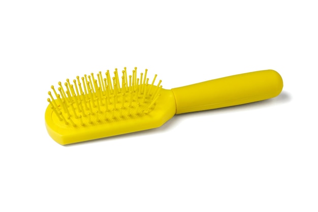 Massage comb yellow isolated on a white background