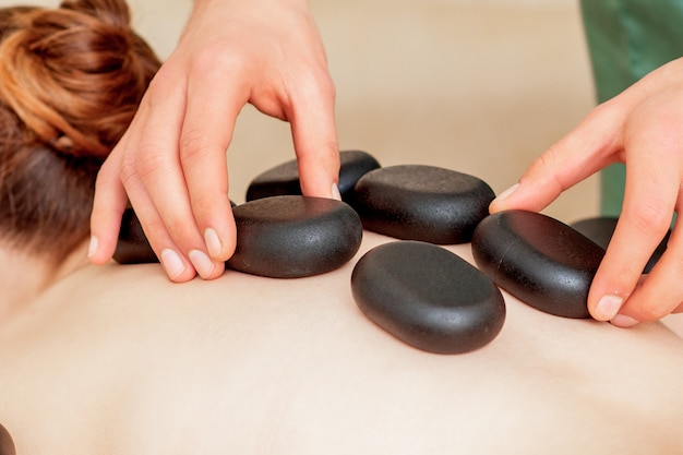 Massage stones on back close up