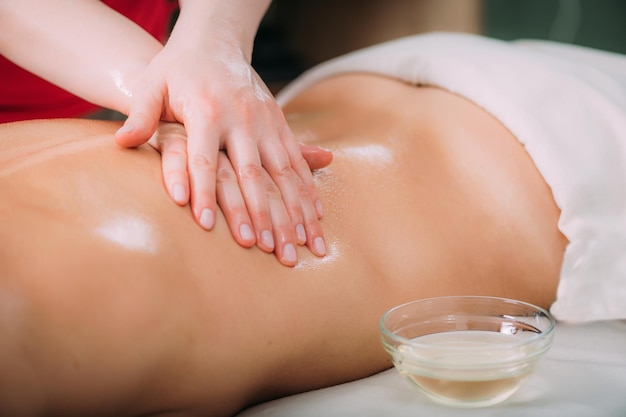 Massage for stress and tension relief Female massage therapist massaging a woman