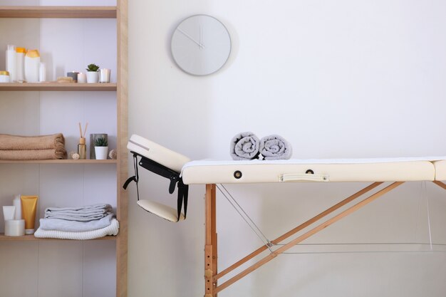 Photo massage table in the interior of a modern wellness center