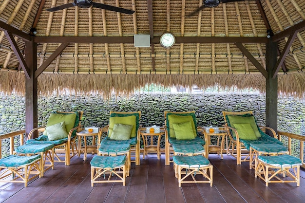 Massage table overlooking the tropical garden spa massage room\
with foot massage chairs on the tropical island bali indonesia