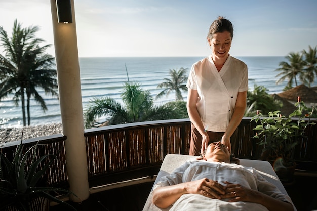 Massage therapist massaging at a spa