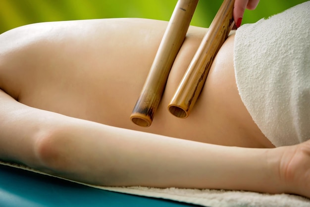 Massage with bamboo sticks