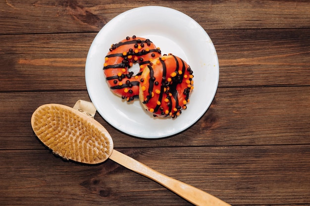 Massage wooden brush for dry massage against cellulite and donuts