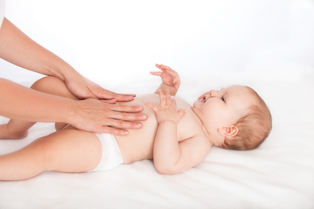 Photo massaging baby's tummy