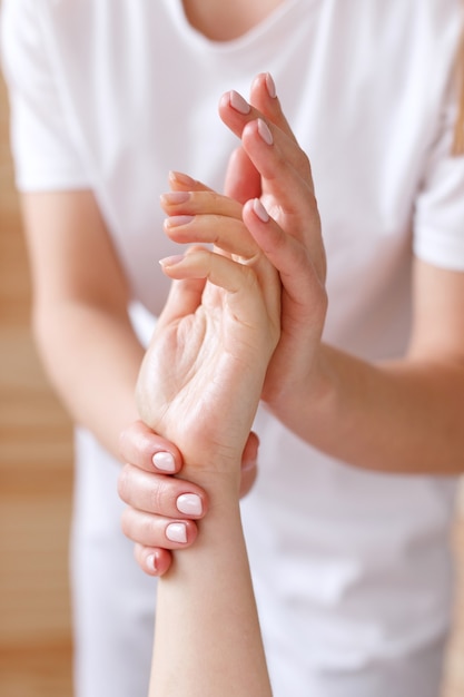 Masseur does hand massage client