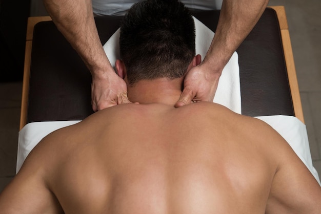 Masseur Doing Massage On Man Body In The Spa Salon