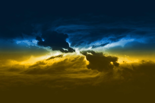 Massive clouds with thunder and lightning discharges of yellowblue color