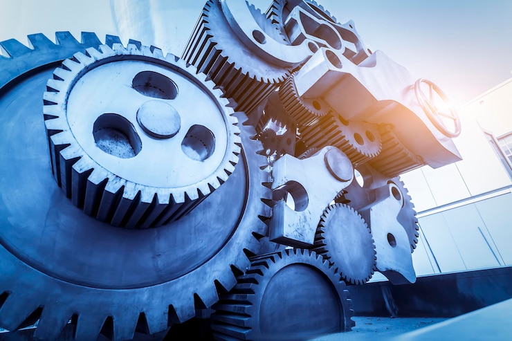 Photo massive industrial gears and cogs in blue tone