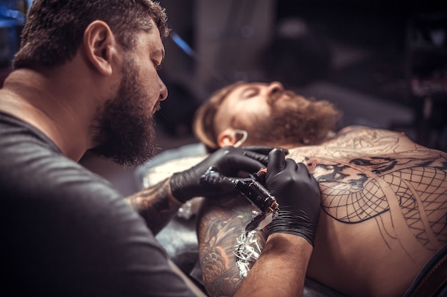 Master of the art of tattooing works studio