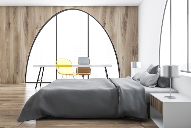 Master bedroom interior with light wooden walls, a master bed and two lamps standing on bedside tables. Arched windows and a home office. 3d rendering mock up