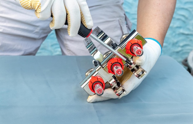 The master carries out installation of a collector for a heatinsulated floor