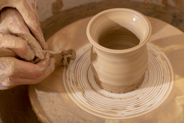 Master class on modeling of clay on a potter's wheel