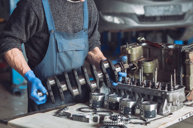 Master collects a rebuilt motor for the car.
