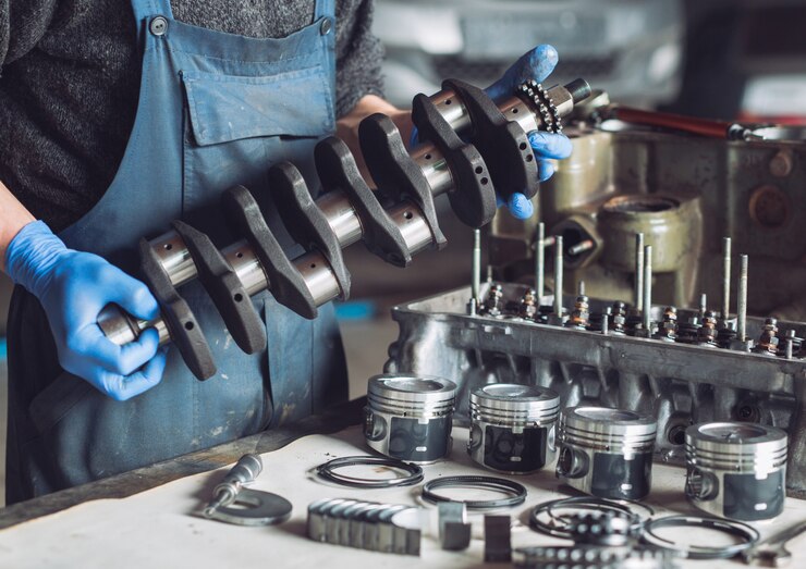 Photo master collects a rebuilt motor for the car.
