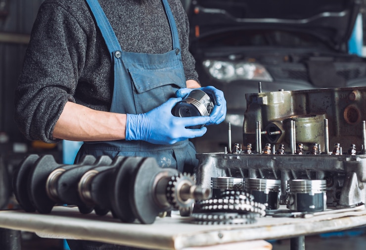 Photo master collects a rebuilt motor for the car.
