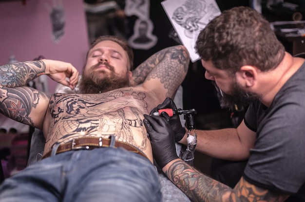 Master does a tattoo in the Studio.