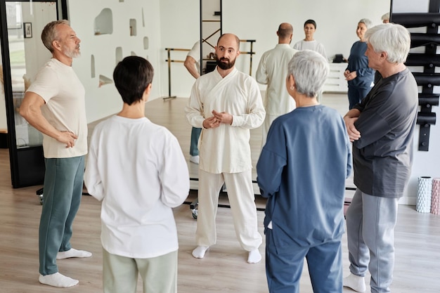 Master explaining importance of qigong practice to senior students