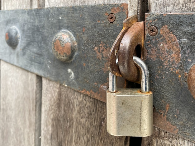 Photo master key lock on the door with rusty metal