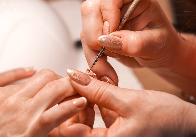 Master of manicure paints nails