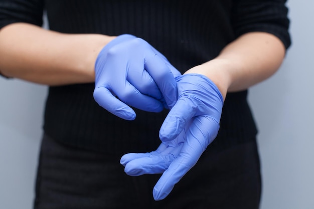 The master puts on blue gloves Sterility