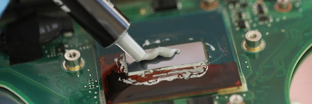 Master puts glue to attach detail to broken laptop professional specialist repairs printed