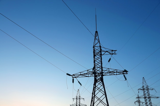 Masts and wires on a blue sky
