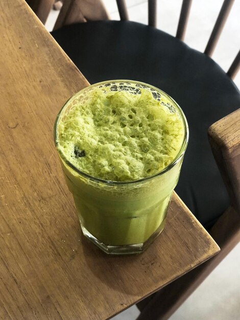 A Matcha green drink on a table top view