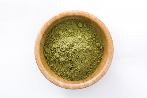 Matcha green tea in a bowl isolated top view