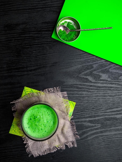 Matcha green tea latte in a glass Top view Copy space Energy boost healthy benefits detox and antioxidants drink