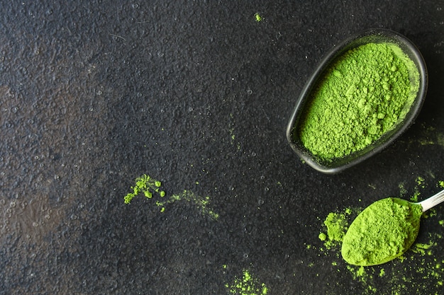 matcha - green tea powder, food supplement, dark background