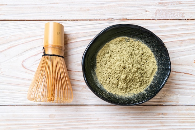 matcha green tea powder with whisk