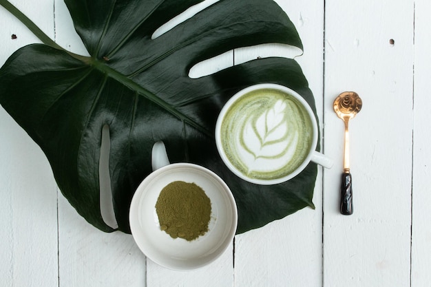 Matcha latte on wooden background