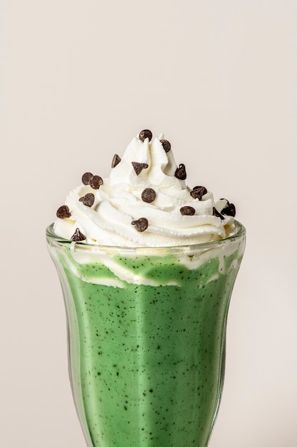 Matcha smoothie topped with whipped cream