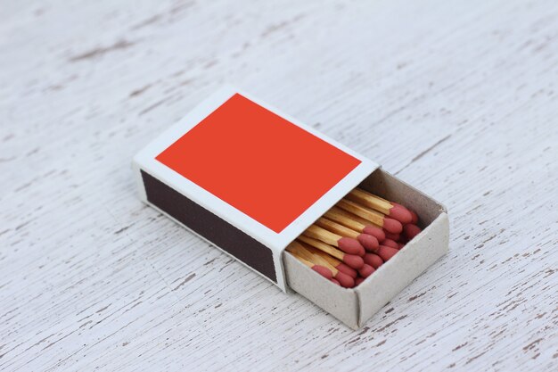 Matches with Paper box on wooden background