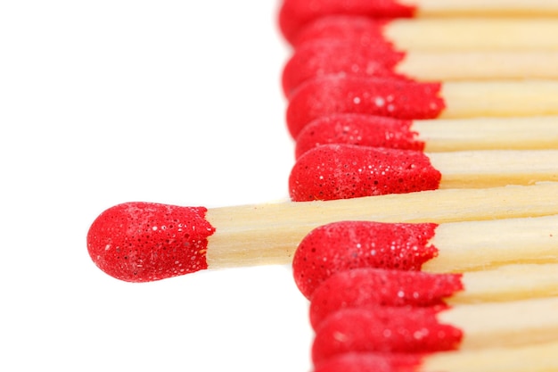 Photo matches with a red head on a white background