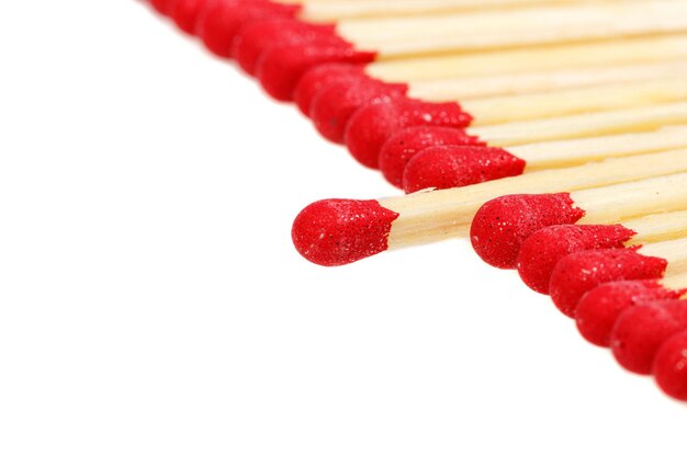 Matches with a red head on a white background