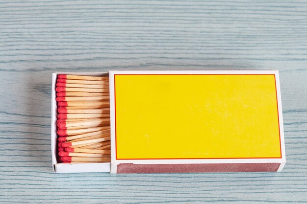 Matchstick on color wood table.