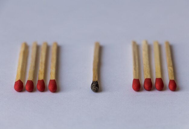 Photo matchsticks arranged over white background