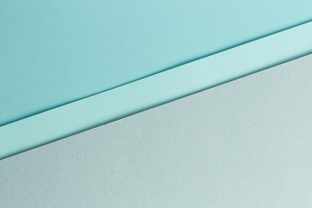 Materiale design sfondo blu i fogli di carta artigianale sono piegati in diversi modi una foto