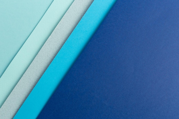 Material design blue background Craft paper sheets are folded in different ways A photo