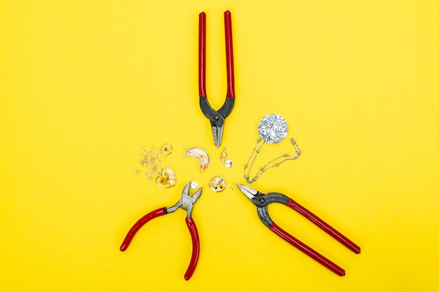 Materials and tools for making accessories on yellow background