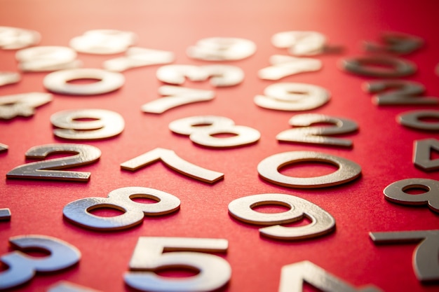 Photo mathematics background made with solid numbers on a board. isolated on red