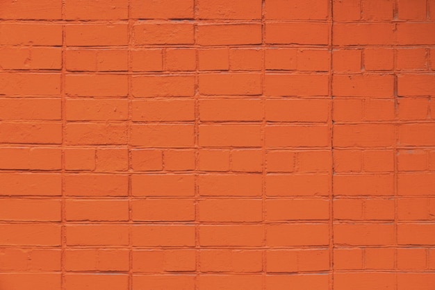 Matte orange painted brick wall full frame flat background and texture