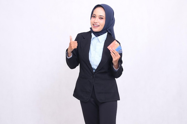 mature asian office woman in hijab standing happy gesture thumbs up like nice and carry credit debit