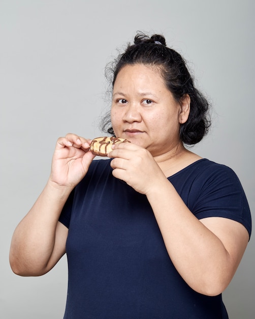 mature asian woman with doughnut