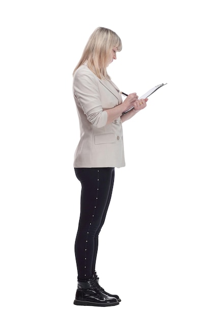 Mature blonde woman writing something to the clipboard