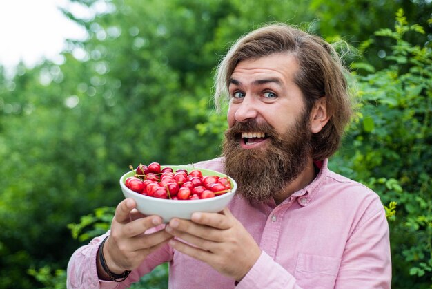 Mature brutal hipster with ripe fresh cherry health