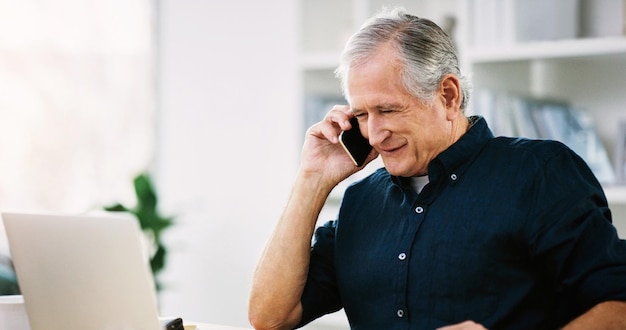 Mature business man and communication on cellphone with a freelance ceo working on laptop and reading email at home 5G phone call and leading senior businesman on negotiation networking call