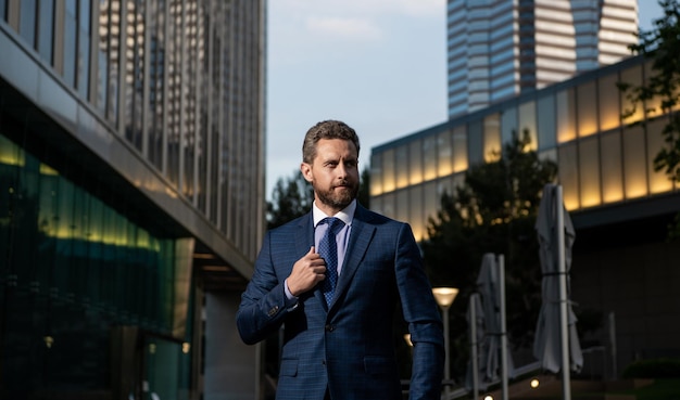 Mature businessman in formalwear outside the office businesslike